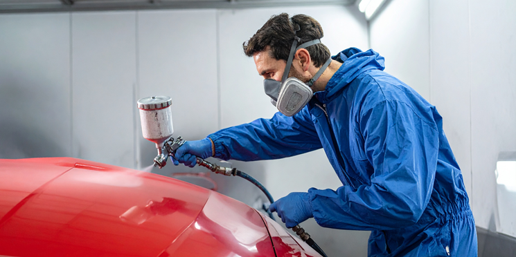 Car Mechanic Spray Painting Car